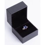 An 18ct tanzanite and diamond ring, size O.