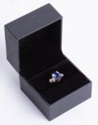 An 18ct tanzanite and diamond ring, size O.