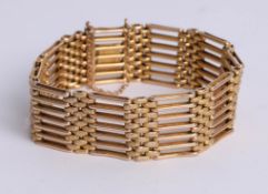 A gold gate bracelet, possibly 18ct, 37g.