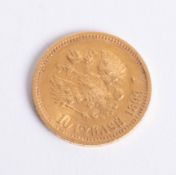 An 1899 gold 10 rouble coin, weighing approximately 8.7g.