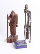 A bronze figure of a seated figure, an oriental cloisonné metal trinket box and a carved wooden