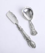 A silver caddy spoon and a butter knife (2).