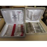 A CHRISTOFLE CASED SET OF TWELVE SILVER PLATED ICE CREAM SPOONS, AND A ORFEVERIE WISKEMANN CASED SET
