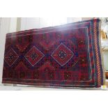RED AND BLUE GROUND HAND KNOTTED WOOLEN MESHWANI RUNNER WITH SIX MEDALLIONS (240CM X 65CM)