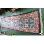 LARGE LOUIS DE POORTERE 'KADJAR' RED AND BLUE GROUND FLORALLY PATTERNED FLOOR RUNNER WITH