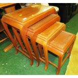 NEST OF FOUR MID WOOD ORIENTAL STYLE OCCASIONAL TABLES WITH GLASS TOPS (A/F)