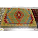 SMALL BEIGE GROUND HAND KNOTTED VEGETABLE DYE KELIM WITH A MULTI COLOURED GEOMETRIC PATTERN (100CM X
