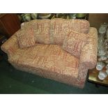 TWO SEATER SOFA BED IN RUST AND GOLD COLOURED UPHOLSTERY