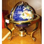 SMALL POLISHED STONE GLOBE IN BRASS FRAME STAND