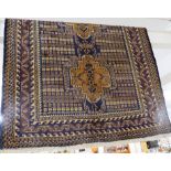 RECTANGULAR BROWN AND BLUE PATTERNED HAND KNOTTED 'OLD BALUCHI' FLOOR RUG WITH TASSELLED ENDS (