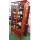 RED HARDWOOD DISPLAY CABINET WITH TWO GLASS DOORS AND TWO CUPBOARD DOORS BENEATH AND ADJUSTABLE