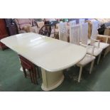 BEIGE COMPOSITE EXTENDING DINING TABLE AND SIX STICK BACK CHAIRS INCLUDING TWO CARVERS