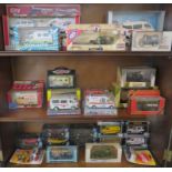 THREE SHELVES OF BOXED DIE-CAST MODEL VEHICLES INCLUDING AMBULANCES