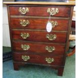 SMALL MAHOGANY CHEST OF FIVE DRAWERS WITH PIERCED BRASS HANDLES, STANDING ON BRACKET FEET