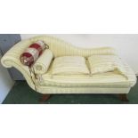 PALE YELLOW AND GOLD STRIPED UPHOLSTERED CHAISE LONGUE WITH BOLSTER AND SCATTER CUSHIONS