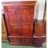 RED HARDWOOD TWO DOOR WARDROBE WITH FOUR DRAWERS TO BASE TOGETHER WITH PAIR OF MATCHING TWO DRAWER