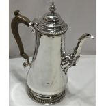 Mappin and Webb Georgian style silver coffee pot with turned finial and light brown plastic