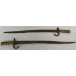 A pair of 19th Century French Chassepot sword bayonets with brass handles, overall length 69.5cm