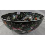 Large Chinese porcelain bowl, black ground, enamelled in the famille rose palette to the interior