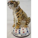 David Cleverly studio pottery figure of a tiger on a domed base painted with red and blue stars