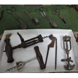 THREE ANTIQUE CORK SCREWS, SNUFFER SCISSORS AND CUTTER