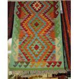 VEGETABLE DYE GREEN GROUND WOVEN WOOLEN CHOKI KELIM RUNNER, RED AND ORANGE GEOMETRIC PATTERN,