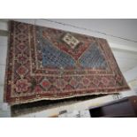 MIDDLE EASTERN RED AND BLUE GROUND FLOOR RUG, PATTERNED WITH STYLIZED PLANTS AND A MEDALLION