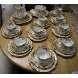 FLORALLY DECORATED PART TEA SERVICE INCLUDING CUPS, SAUCERS AND PLATES