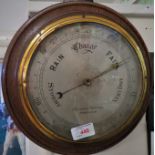 OAK MOUNTED ANEROID BAROMETER WITH ENGINE TURNED DIAL, HARRISONS OPTICIANS BIRMINGHAM