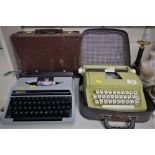 TWO VINTAGE TYPEWRITERS WITH CASES AND SMALL TRAVEL CASE