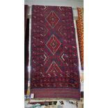 HAND KNOTTED WOOLLEN RED GROUND PATTERNED FLOOR RUNNER (APPROXIMATELY 254CM X 58CM)