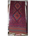HAND KNOTTED RED GROUND WOOLLEN FLOOR RUNNER WITH FIVE MEDALLIONS (APPROXIMATELY 244CM X 60CM)