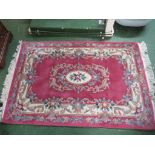 PINK GROUND ENBOSSED FLORAL PATTENED RUG WITH TASSELLED ENDS