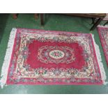 PINK ROUND RECTANGULAR ENBOSSED PATTENED RUG WITH TASSELLED ENDS