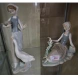 TWO LLADRO FIGURINES - SEATED WOMAN WITH DOVE AND GIRL WITH GOOSE