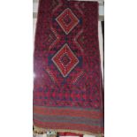 HAND KNOTTED RED GROUND WOOLLEN FLOOR RUNNER WITH FIVE MEDALLIONS (APPROXIMATELY 244CM X 60CM)