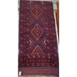 HAND KNOTTED WOOLLEN RED GROUND PATTERNED FLOOR RUNNER (APPROXIMATELY 254CM X 58CM)