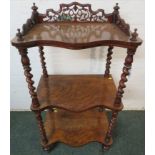 Victorian serpentine front walnut three-tier what-not, spiral turned supports, pierced and carved