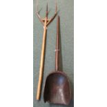 A wooden grain scoop (length 140cm) and a wooden pitch fork (length 163cm)