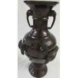 Japanese style bronzed metal baluster vase moulded in high relief with birds in branches, the body