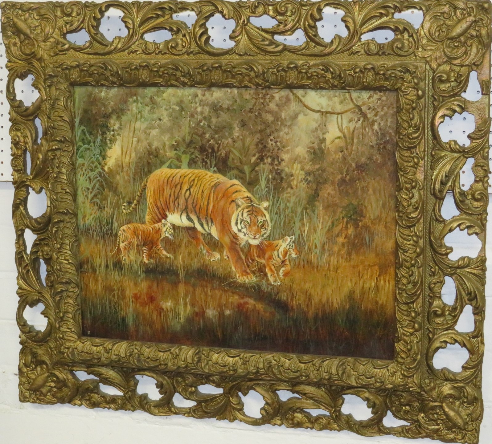 Tiger and cubs at waterside, oil on board, no signature (39cm x 50cm), in a broad foliate pierced - Image 2 of 3