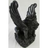 Indonesian carved black stonewood figure of Garuda, height 34.5cm, length 27cm, width 20.5cm