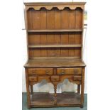 A small oak dresser (height 162cm, width 92cm, depth 37cm), the upper section with wavy