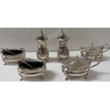 A matching suite of Garrard & Co silver condiments comprising a pair of salts with blue glass