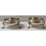 Pair of John Muns George II silver salts with beaded rim and raised on three paw feet, marks for