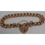 Yellow metal bracelet of hollow links with a heart-shape clasp, the clasp marked for 15 carat gold,