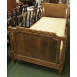 Light oak single bed frame with dowel joins, the head and foot boards with carved chevron borders