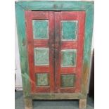 Indian stained wood cupboard, the front and the two doors stained red and green, with alternating