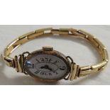 Ladies 9 carat gold Art Deco style wristwatch, oval dial with distinctive chapter of Arabic numerals