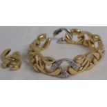 Yellow metal bracelet of hollow links set with diamonds, the bracelet of fourteen links (plus two